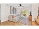 Relaxing living room with sectional sofa, hardwood floors and access to a balcony at 651 Celebration Ave # 651, Celebration, FL 34747