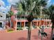 Street view of shops and buildings; pink building at 651 Celebration Ave # 651, Celebration, FL 34747