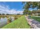 Scenic walking path along a pond in a community at 651 Celebration Ave # 651, Celebration, FL 34747