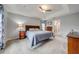 Spacious bedroom with carpeted floor, ceiling fan and dresser at 7017 Bridle Path, Saint Cloud, FL 34771