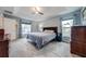 Bright bedroom with window, ceiling fan, and carpeted floor at 7017 Bridle Path, Saint Cloud, FL 34771