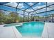 Refreshing screened-in pool and spa at 7017 Bridle Path, Saint Cloud, FL 34771