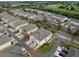 Aerial view of community featuring townhouses and landscaped areas at 7136 Red Lantern Dr # 7136, Harmony, FL 34773