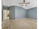 Bright bedroom with ceiling fan and access to bathroom at 7136 Red Lantern Dr # 7136, Harmony, FL 34773