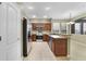 Modern kitchen with stainless steel appliances and wood cabinets at 7136 Red Lantern Dr # 7136, Harmony, FL 34773