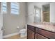 Bathroom with granite countertop, toilet and shower at 7430 Marker Ave, Kissimmee, FL 34747