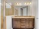 Double vanity bathroom with granite countertops at 7430 Marker Ave, Kissimmee, FL 34747