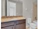 Bathroom with granite countertop and dark brown vanity at 7430 Marker Ave, Kissimmee, FL 34747