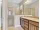 Bathroom with granite countertops and walk-in shower at 7430 Marker Ave, Kissimmee, FL 34747