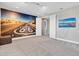 Bright bedroom featuring a Route 66 mural and a large TV at 7430 Marker Ave, Kissimmee, FL 34747