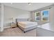 Bright bedroom with plush carpeting and large windows at 7430 Marker Ave, Kissimmee, FL 34747