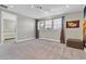 Spacious bedroom with window, carpet, and room for furniture at 7430 Marker Ave, Kissimmee, FL 34747