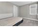 Bedroom with a queen-size bed and neutral wall at 7430 Marker Ave, Kissimmee, FL 34747