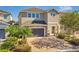 Two-story house with a gray garage door and brick facade at 7430 Marker Ave, Kissimmee, FL 34747
