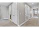 Hallway with carpet and access to bedrooms at 7430 Marker Ave, Kissimmee, FL 34747