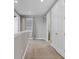 Upper level hallway with carpet and access to bathroom at 7430 Marker Ave, Kissimmee, FL 34747