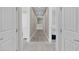 Upper hallway with carpet and doors to bedrooms at 7430 Marker Ave, Kissimmee, FL 34747