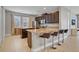 Kitchen island with granite countertop and bar stools at 7430 Marker Ave, Kissimmee, FL 34747