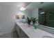 Elegant bathroom with double vanity and a large mirror at 800 Benoi Dr, Davenport, FL 33896