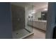 Modern bathroom with a walk-in shower and double vanity at 800 Benoi Dr, Davenport, FL 33896
