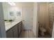 Clean bathroom with double vanity, a shower, and modern finishes at 800 Benoi Dr, Davenport, FL 33896