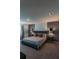Spacious Primary bedroom with a king-size bed and an elegant color scheme at 800 Benoi Dr, Davenport, FL 33896