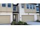 Modern two-story townhome with attached two-car garage at 800 Benoi Dr, Davenport, FL 33896