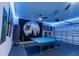 Finished garage with ping pong table and fun decor at 800 Benoi Dr, Davenport, FL 33896