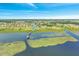 Boardwalk leading to community lake with homes nearby at 820 Windlass Ct, Kissimmee, FL 34746