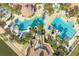 Resort-style pool with lap lanes, a water slide, and multiple lounging areas at 820 Windlass Ct, Kissimmee, FL 34746