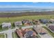 Luxury homes with tile roofs situated on a quiet street near a lake at 820 Windlass Ct, Kissimmee, FL 34746