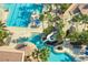 Community pool with a water slide and plenty of lounge chairs for relaxation at 820 Windlass Ct, Kissimmee, FL 34746