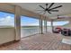 Enjoy stunning views from this private balcony featuring brick flooring, comfortable seating, and plenty of space at 820 Windlass Ct, Kissimmee, FL 34746