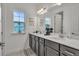 Modern bathroom with double vanity and dark cabinets at 820 Windlass Ct, Kissimmee, FL 34746