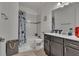 Bathroom with tub, shower, and dark vanity at 820 Windlass Ct, Kissimmee, FL 34746