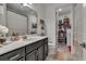 Bathroom features dark vanity, walk-in shower and linen closet at 820 Windlass Ct, Kissimmee, FL 34746