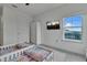 Bright bedroom with twin beds and window views at 820 Windlass Ct, Kissimmee, FL 34746