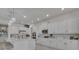 Modern kitchen with stainless steel appliances, stone countertops, pendant lighting, and a seamless backsplash at 820 Windlass Ct, Kissimmee, FL 34746