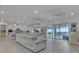 Bright, open living space with a view to the patio, featuring tile floors, modern ceiling fans, and a spacious sectional sofa at 820 Windlass Ct, Kissimmee, FL 34746