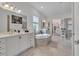 Spacious main bathroom with a soaking tub and double sinks at 820 Windlass Ct, Kissimmee, FL 34746