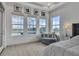 Bright main bedroom with large windows overlooking the pool area at 820 Windlass Ct, Kissimmee, FL 34746