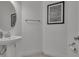 Small powder room with sink and toilet at 820 Windlass Ct, Kissimmee, FL 34746