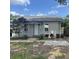 Charming bungalow with landscaped yard and paved patio at 823 Jersey Ave, St Cloud, FL 34769