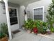 Condo front door entrance with lush potted plants at 935 Northern Dancer Way # 105, Casselberry, FL 32707