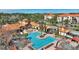 Aerial view of community pool and surrounding buildings at 1375 Tuscana Ln # 1106, Davenport, FL 33896
