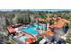 Resort-style community pool with multiple areas,cabana, and palm trees at 1375 Tuscana Ln # 1106, Davenport, FL 33896
