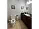 Clean bathroom with dark wood cabinets and granite countertop at 1375 Tuscana Ln # 1106, Davenport, FL 33896