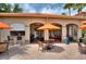 Community bar with outdoor seating and umbrellas at 1375 Tuscana Ln # 1106, Davenport, FL 33896