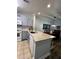 Modern kitchen with granite countertops and gray cabinets at 1375 Tuscana Ln # 1106, Davenport, FL 33896