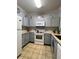 Updated kitchen with gray cabinets and granite counters at 1375 Tuscana Ln # 1106, Davenport, FL 33896